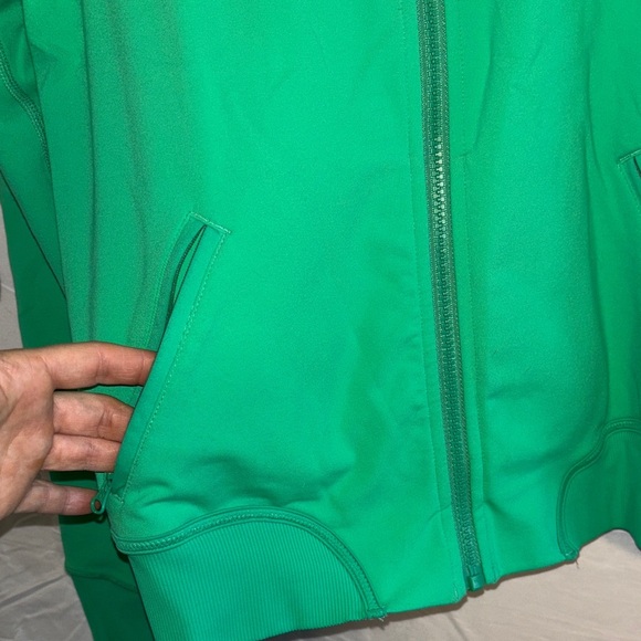 This is a Lululemon Om Me Home yoga jacket in green Luon fabric. - Picture 6 of 8